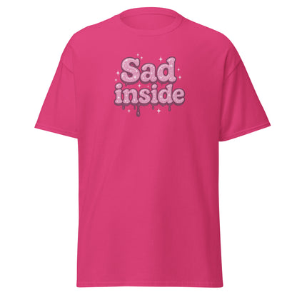 Pink t-shirt with 'Sad inside' text on a white background