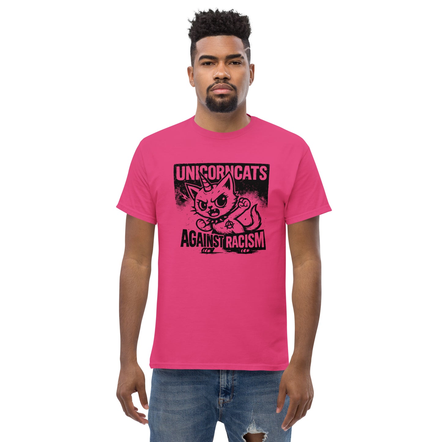Person wearing pink shirt with a unicorncat and the slogan "Unicorncats against racism"
