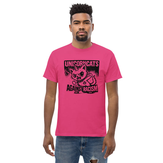 Person wearing pink shirt with a unicorncat and the slogan "Unicorncats against racism"
