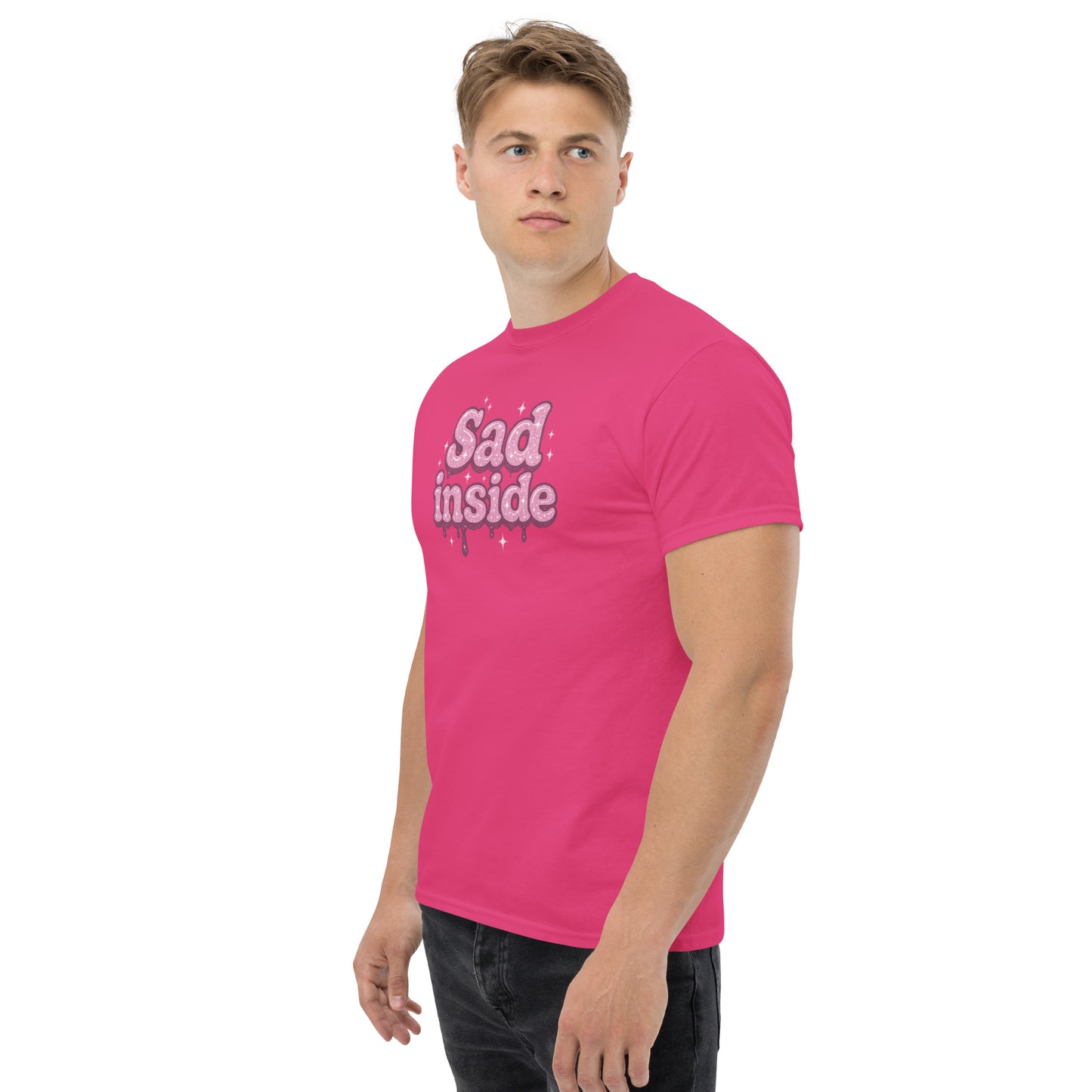 Person wearing a pink t-shirt with 'Sad inside' text on a white background