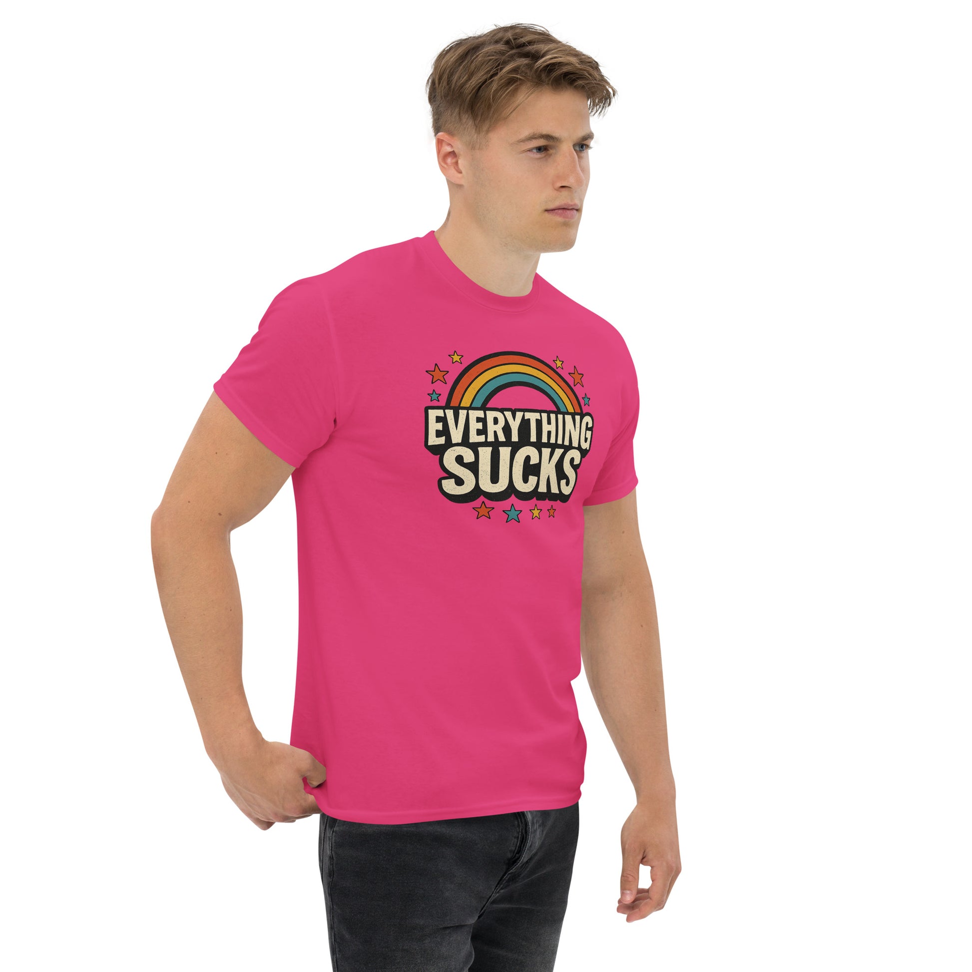 Person wearing a pink t-shirt with 'Everything Sucks' text and rainbow design on a white background