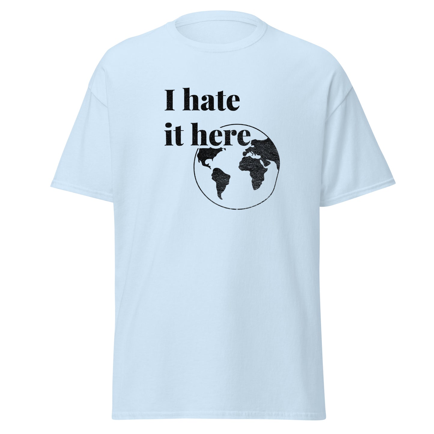 Light blue t-shirt with 'I hate it here' text and world map graphic on a white background