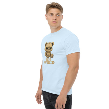 Man wearing a light blue t-shirt with a bear graphic and text on a white background