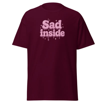 Maroon t-shirt with 'Sad inside' text in pink on a white background