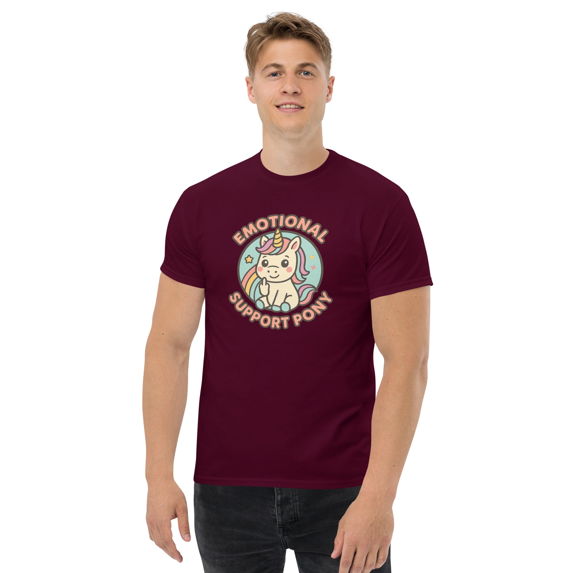 Person wearing a maroon t-shirt with a unicorn graphic and text on a white background
