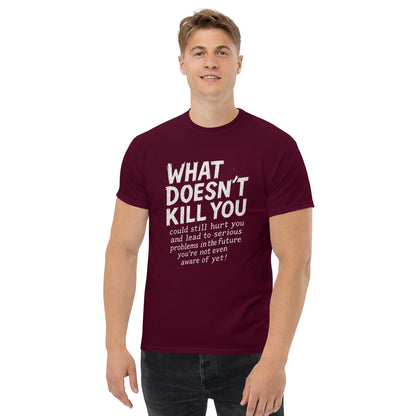 Man wearing a maroon t-shirt with white text on a white background