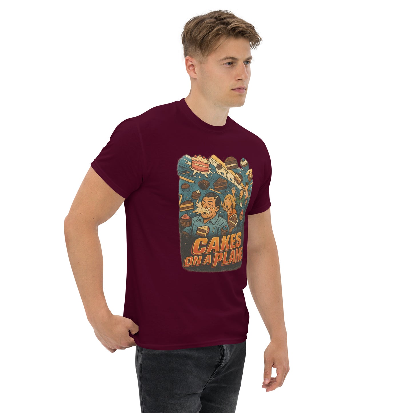 Man wearing a maroon t-shirt with a graphic design on a white background