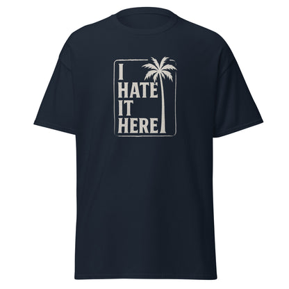 Black t-shirt with 'I Hate It Here' text and palm tree design on a white background