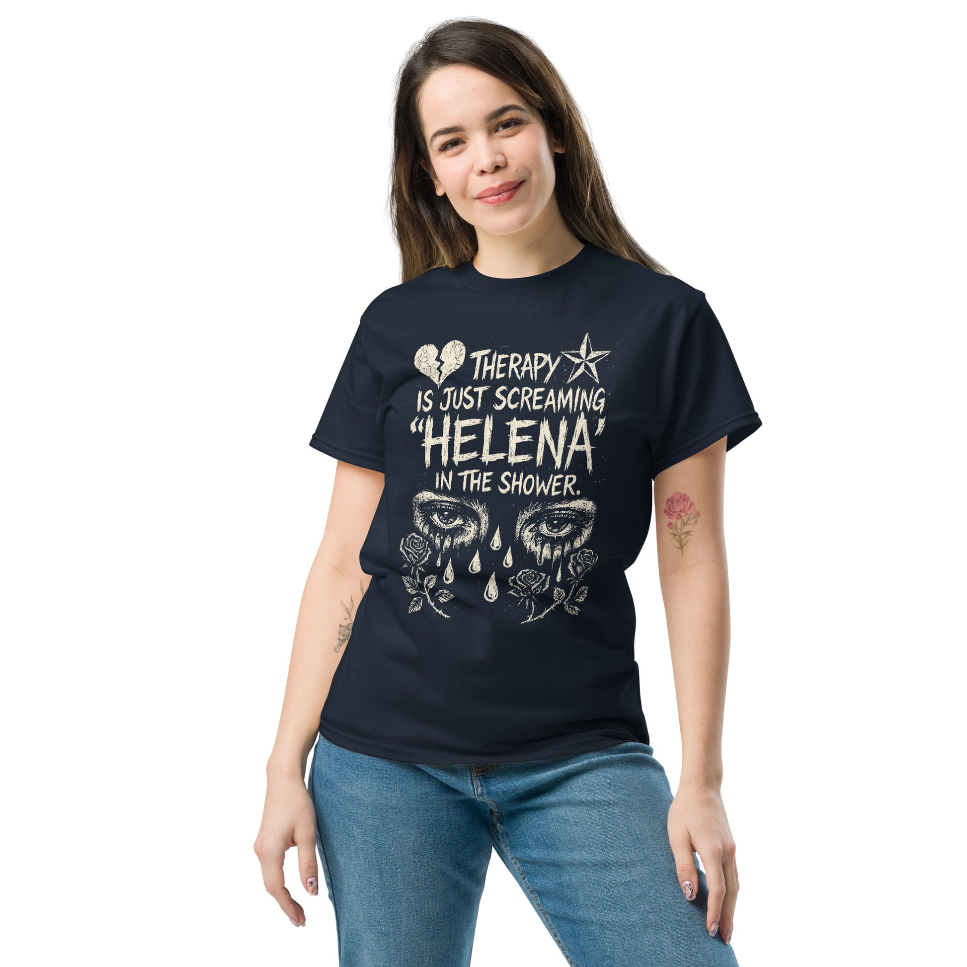 Woman wearing a black t-shirt with a graphic design and text, standing against a white background