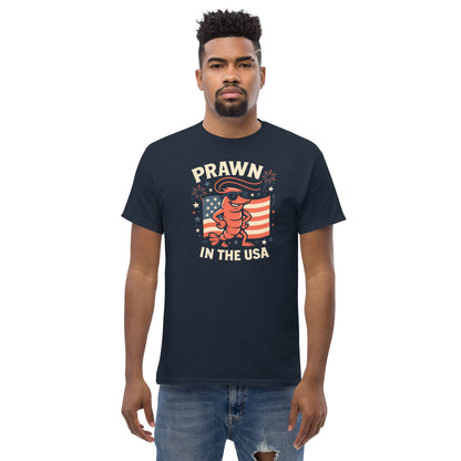 Man wearing a black t-shirt with 'Prawn in the USA' graphic design on a white background