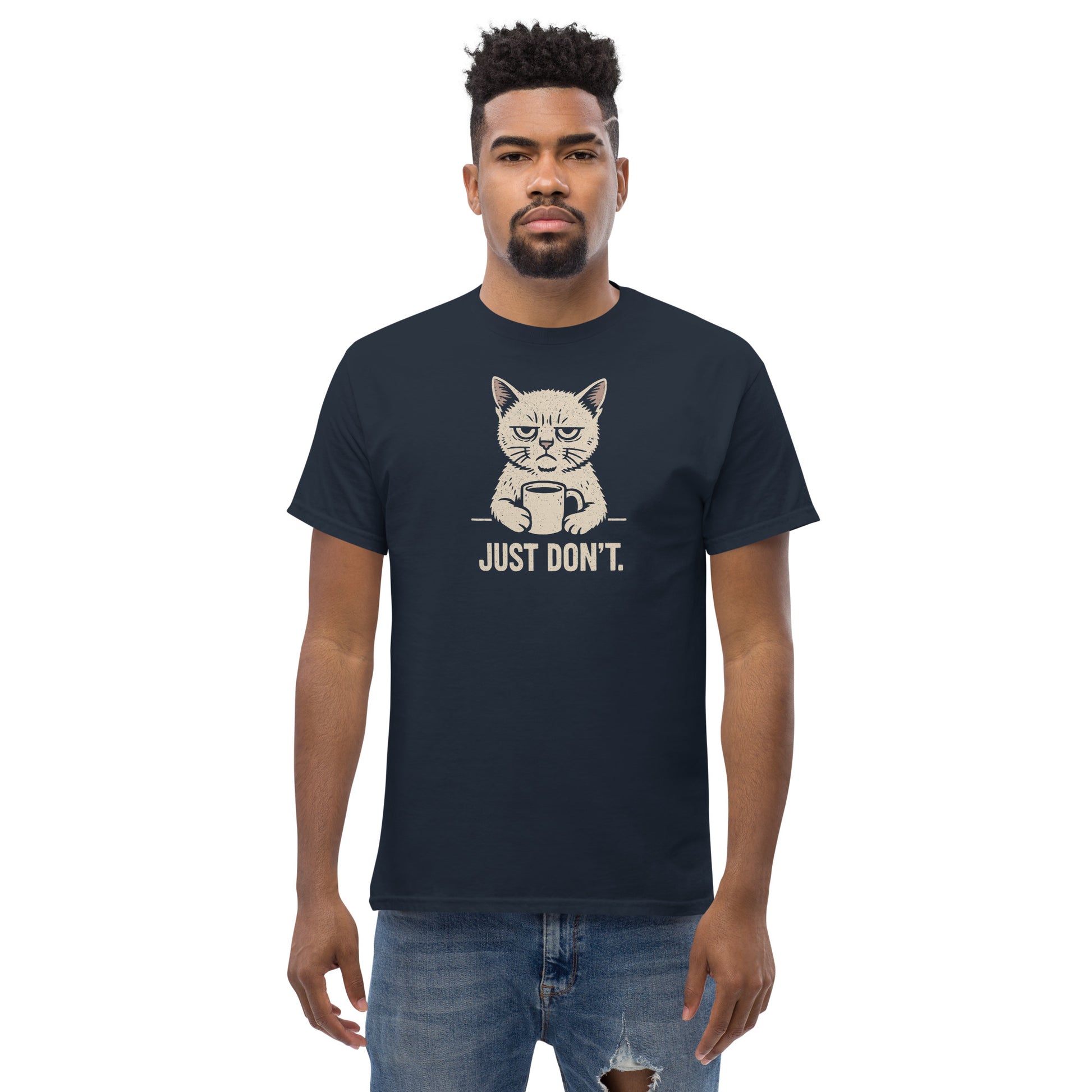Man wearing a navy blue t-shirt with a cat graphic and text on a white background