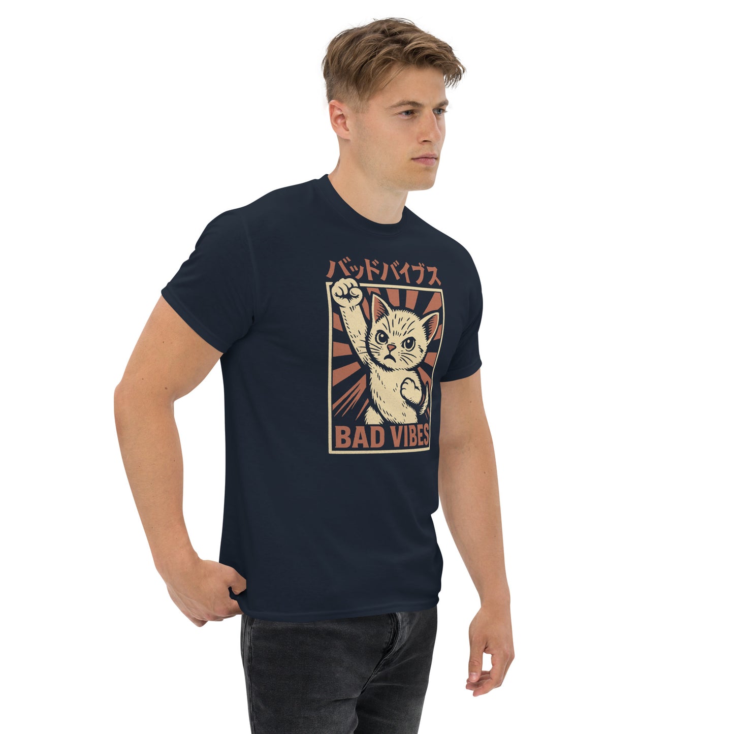 Man wearing a navy blue t-shirt with a graphic of a cat and text on a white background