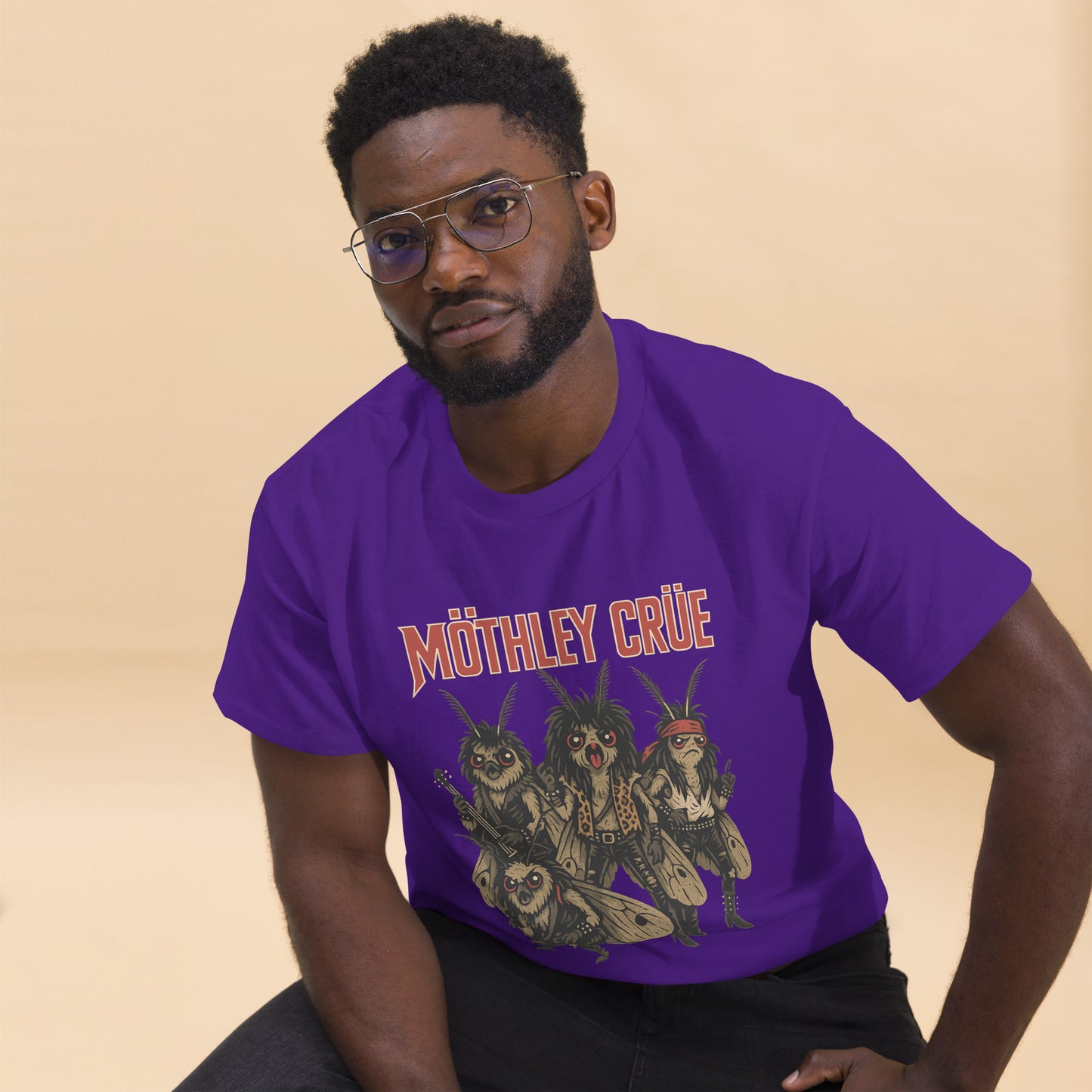 man wearing purple Unisex Mothley Crüe t-shirt with chaotic rock parody design, front view