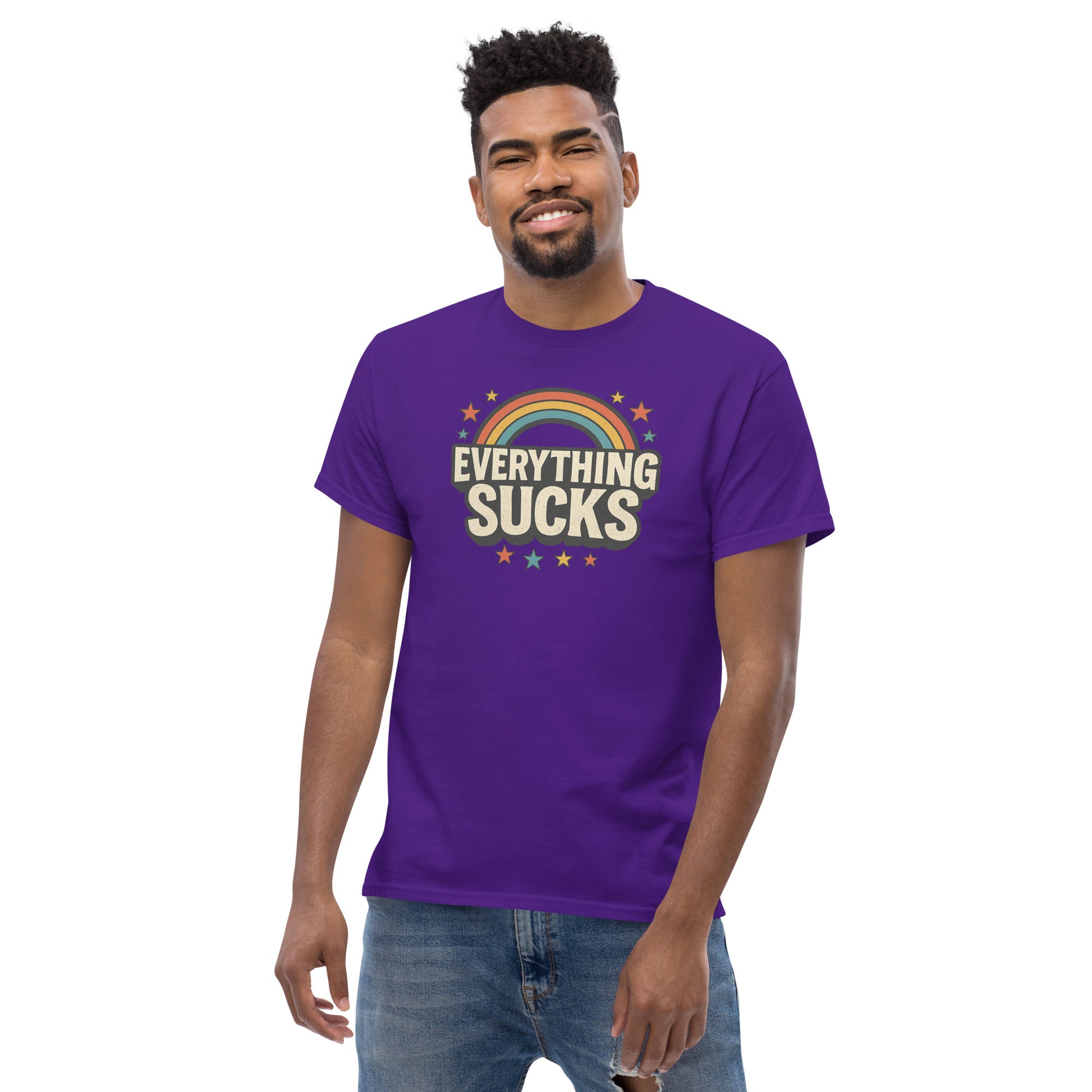 Man wearing a purple t-shirt with 'Everything Sucks' text and rainbow design on a white background