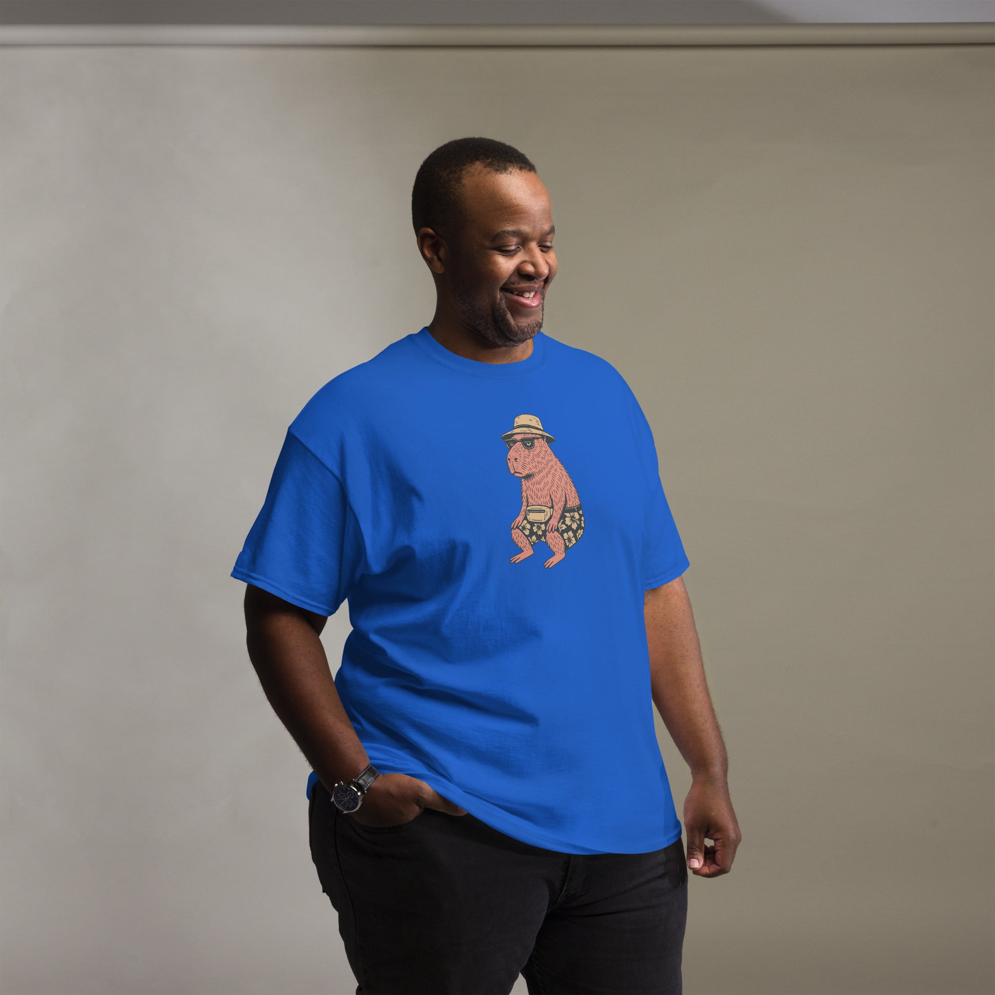 Man wearing blue Unisex Happybara t-shirt with quirky animal design, front view