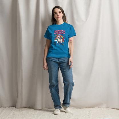 Person wearing a blue t-shirt with a graphic design and text, standing against a plain background