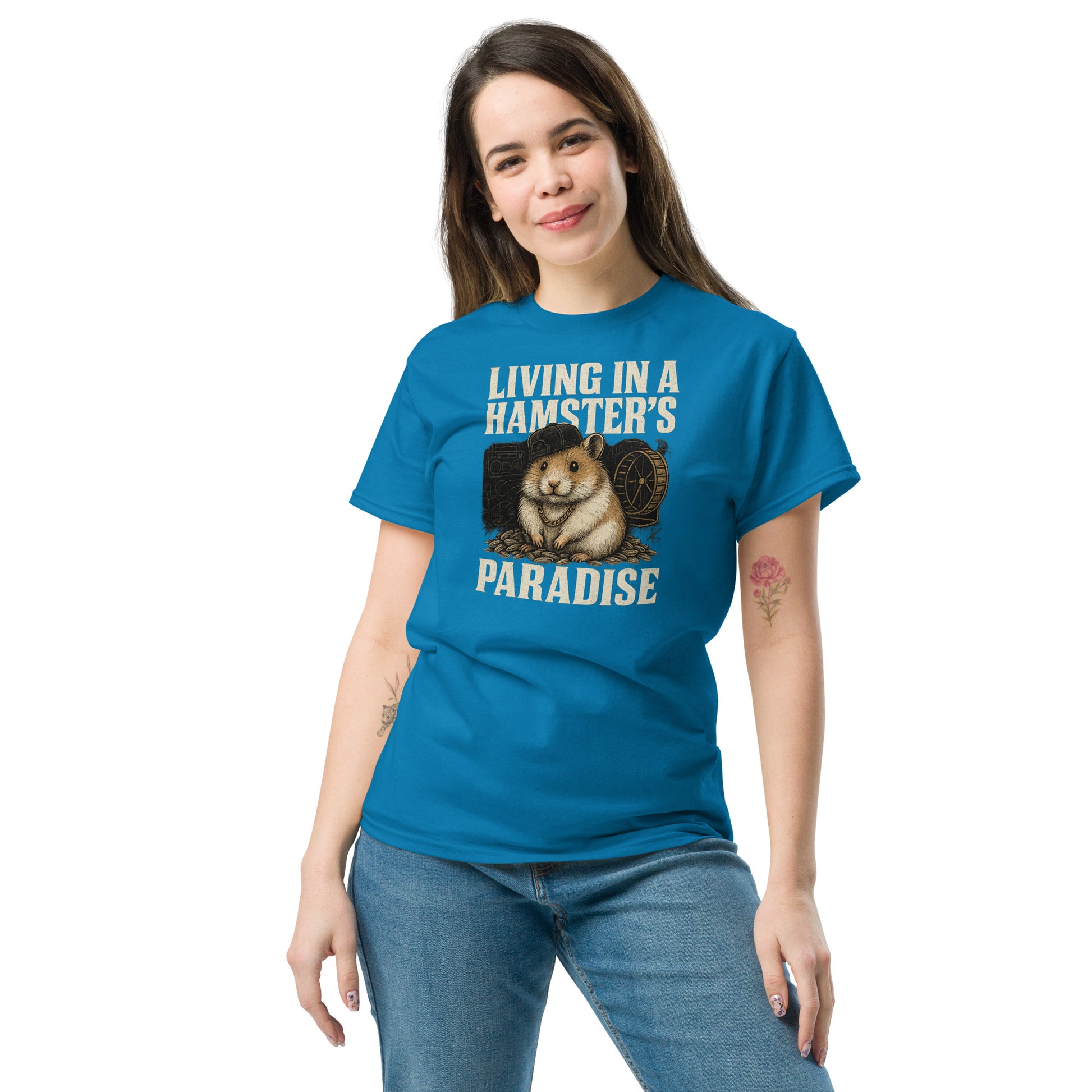 Woman wearing a blue t-shirt with a graphic of a hamster and text 'Living in a Hamster's Paradise' on a white background