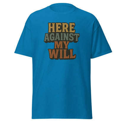 Blue t-shirt with 'HERE AGAINST MY WILL' text on a white background