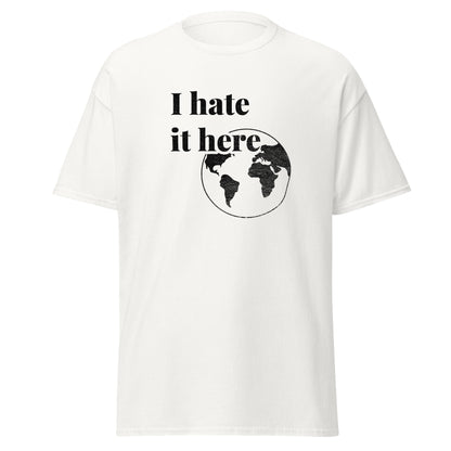 White t-shirt with 'I hate it here' text and world map graphic on a white background
