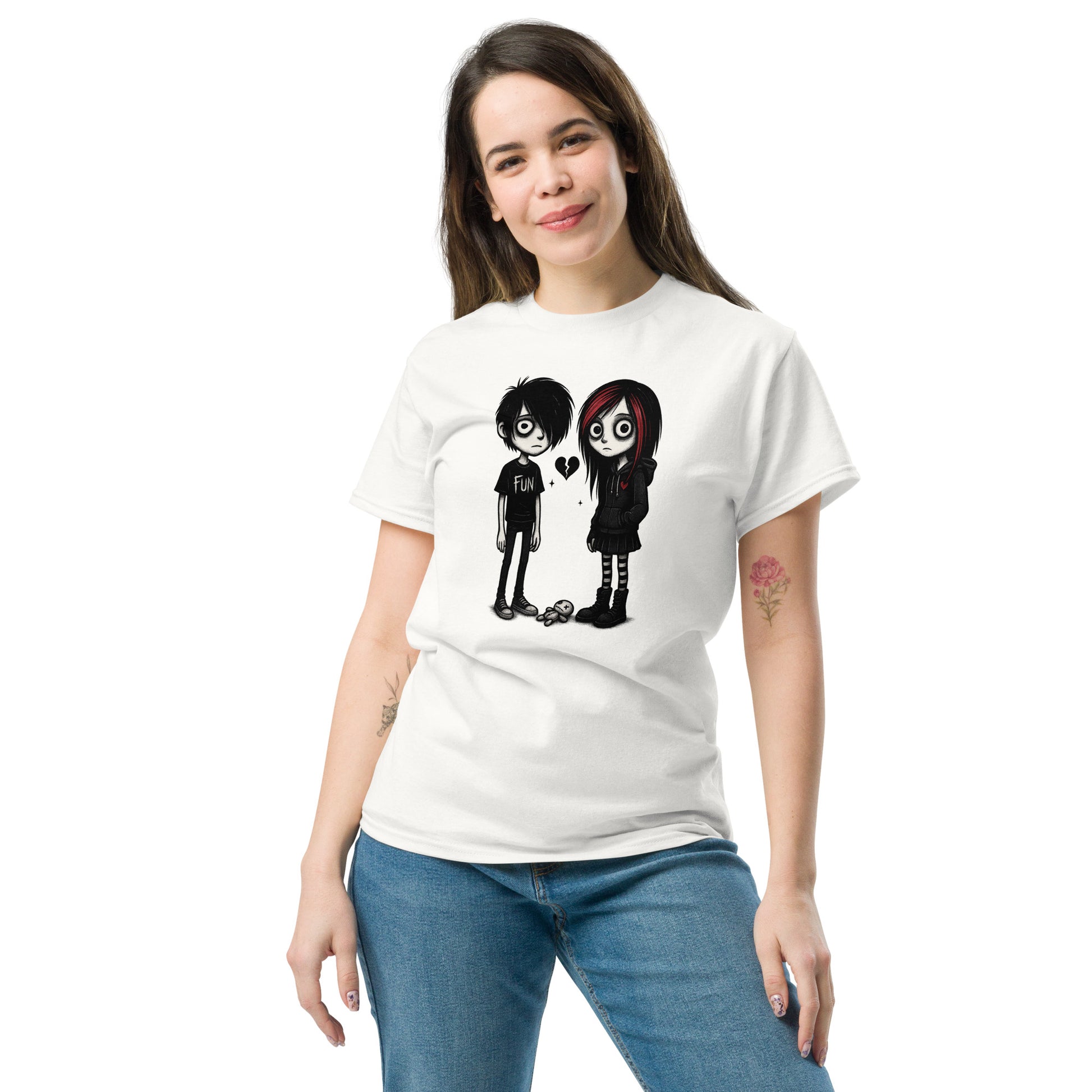 Woman wearing a white t-shirt with a graphic design of two cartoon characters holding hands on a white background.