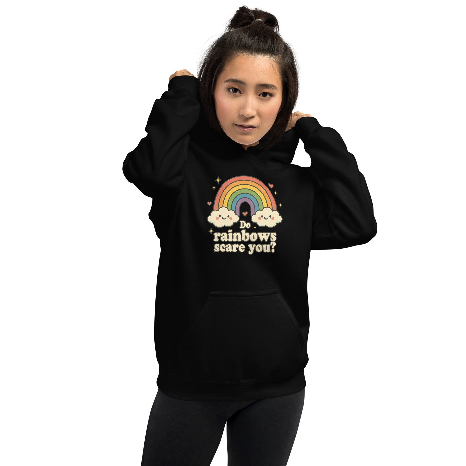 Person wearing a black hoodie with a rainbow and cloud design and text.