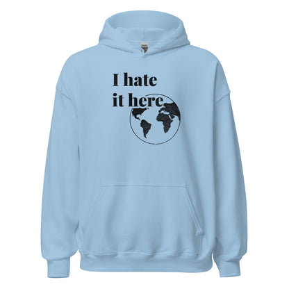 Light blue hoodie with 'I hate it here' text and world map graphic on a white background