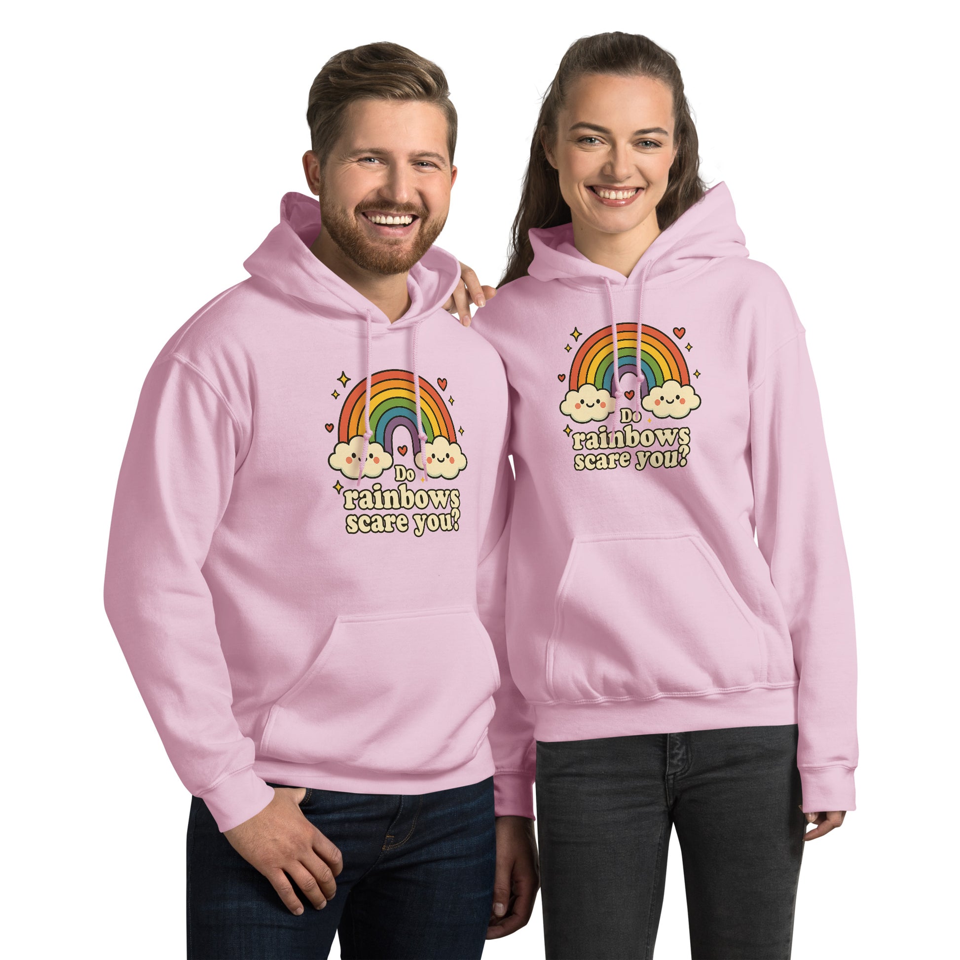 Two people wearing pink hoodies with rainbow designs and text.