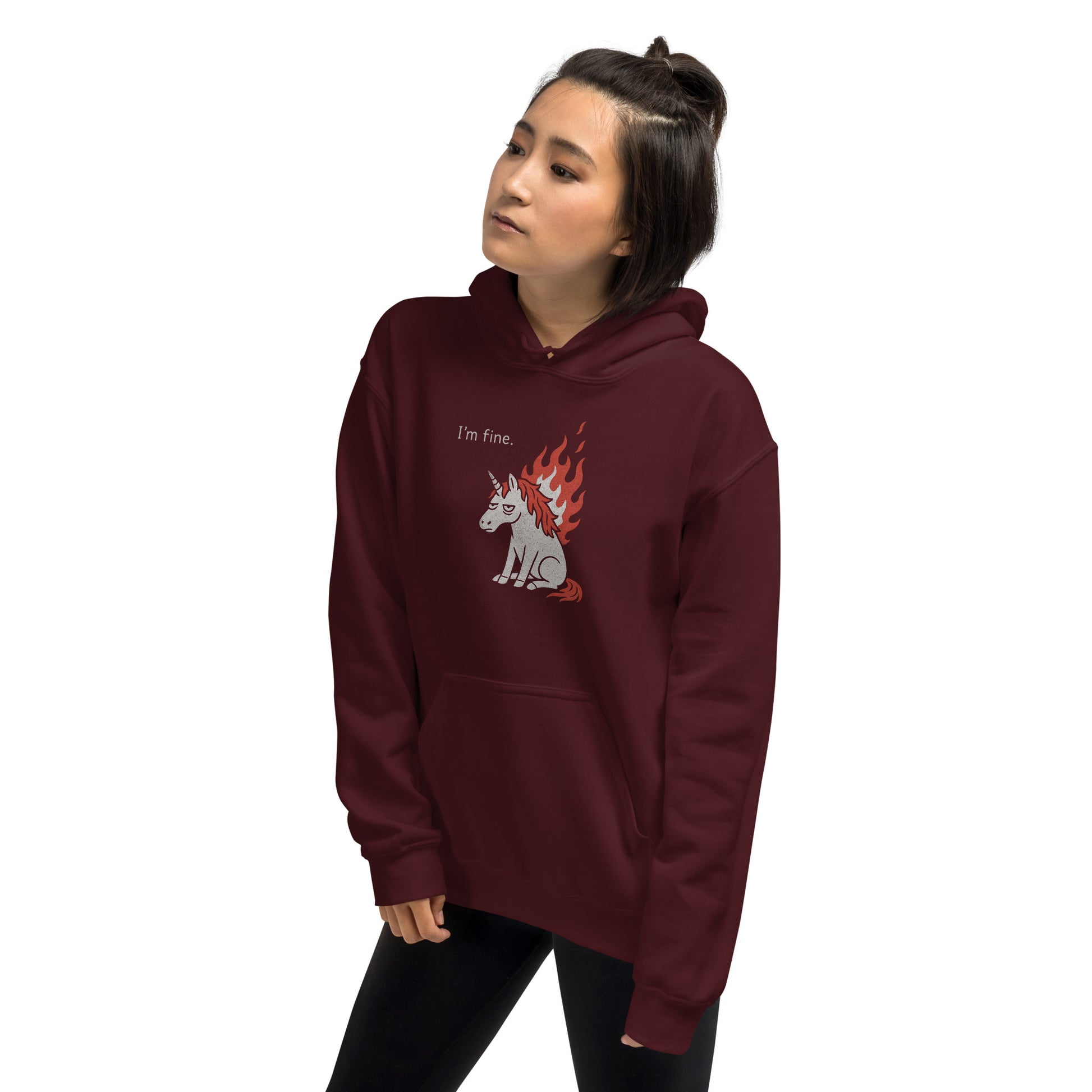 Person wearing a maroon hoodie with a graphic design on a white background