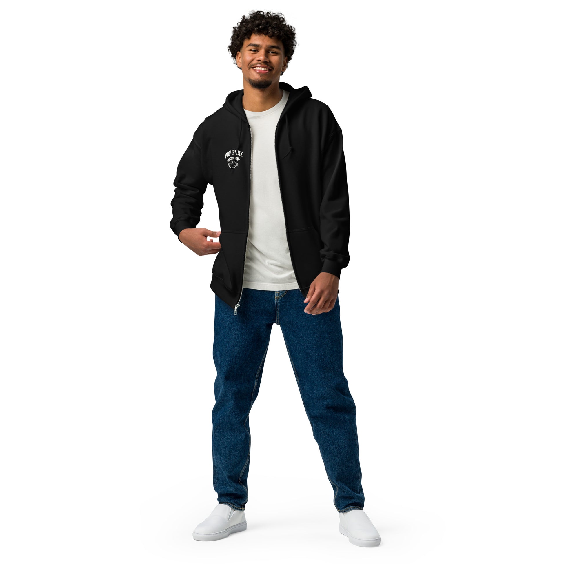 Man wearing a black hoodie, white t-shirt, blue jeans, and white sneakers on a white background