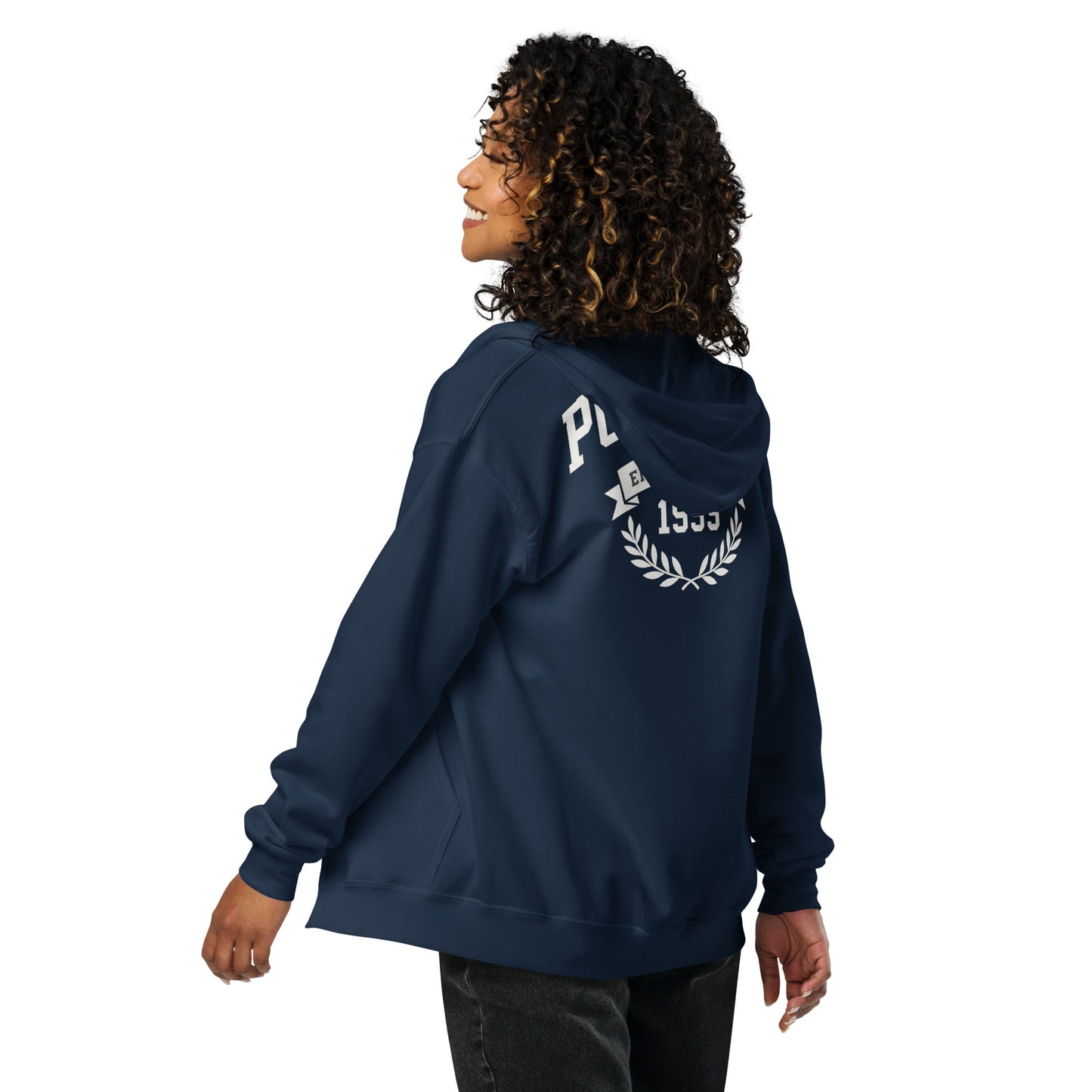 Person wearing a navy blue hoodie with a logo on the back against a white background