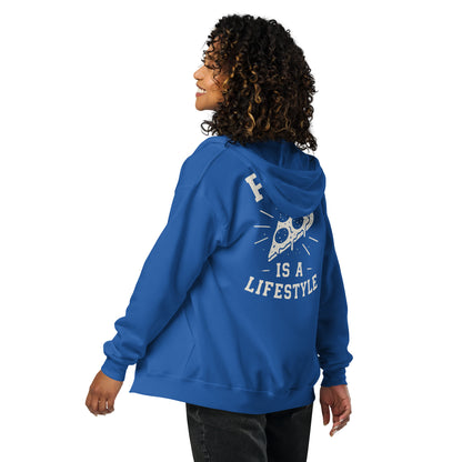 Person wearing a blue hoodie with a graphic design and text on the back, on a white background