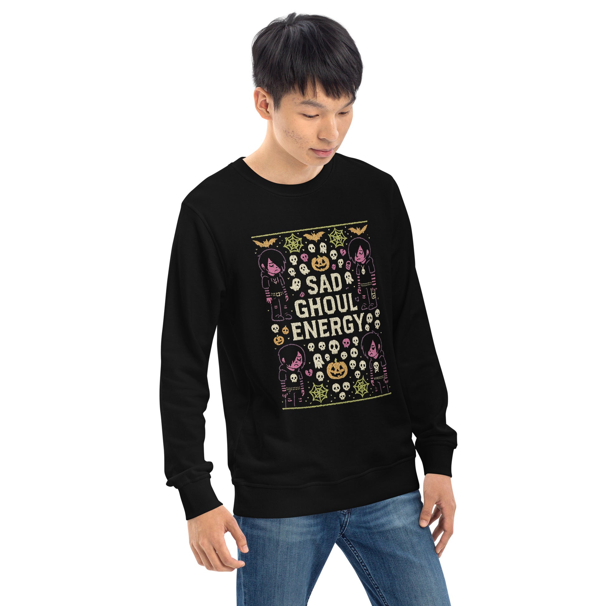 Person wearing a black sweatshirt with Halloween-themed design on a white background
