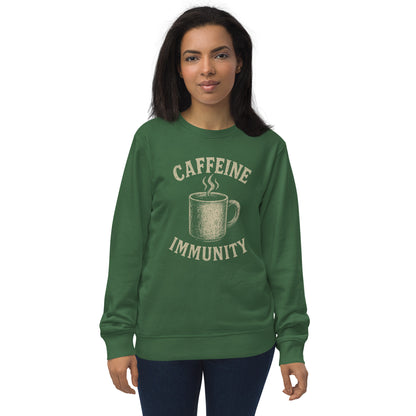 Person wearing a green sweatshirt with 'CAFFEINE IMMUNITY' text and coffee cup graphic on a white background