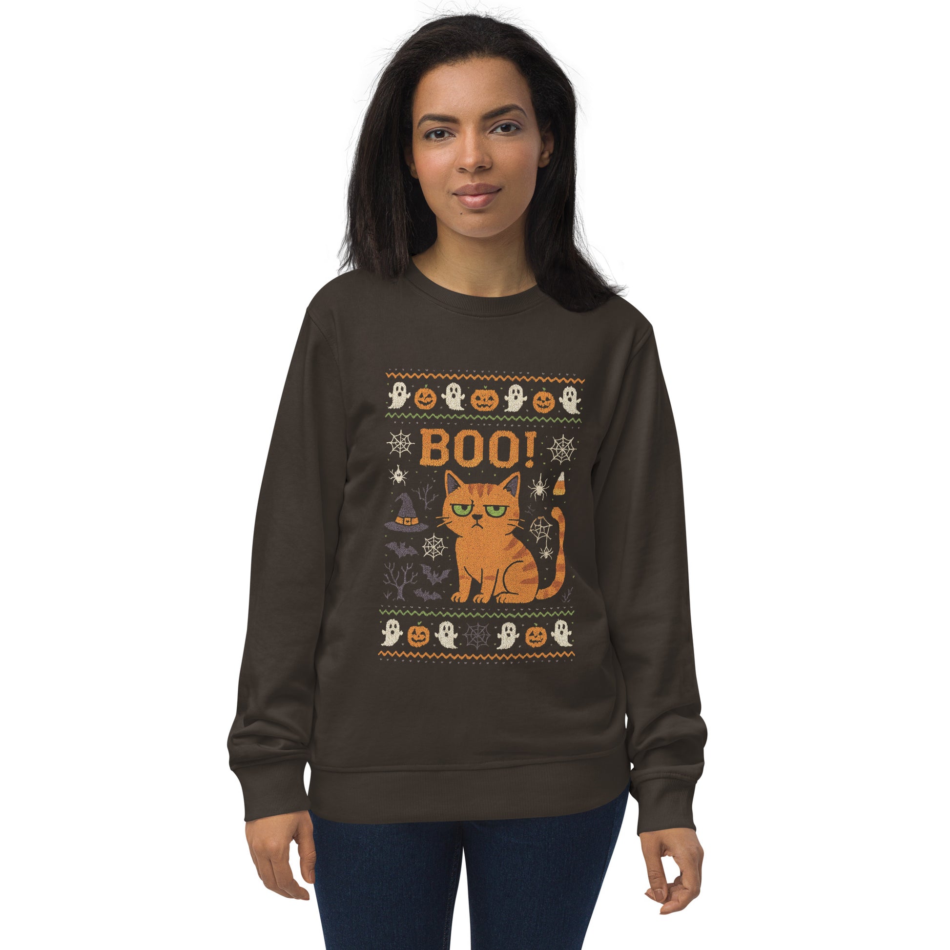 Woman wearing a brown sweatshirt with Halloween-themed design featuring a cat and text.