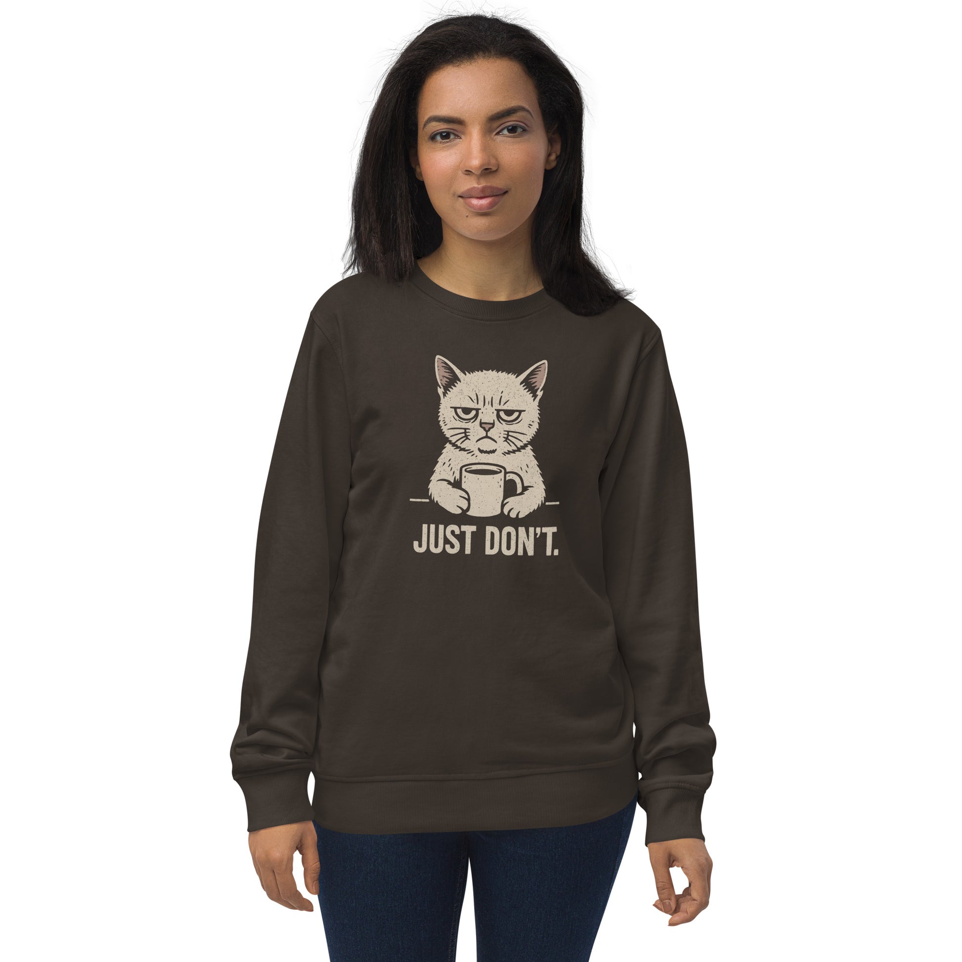 Woman wearing a dark brown sweatshirt with a cat graphic and text on a white background