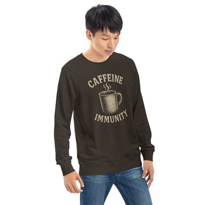 Person wearing a brown sweatshirt with 'CAFFEINE IMMUNITY' text and coffee cup graphic on a white background