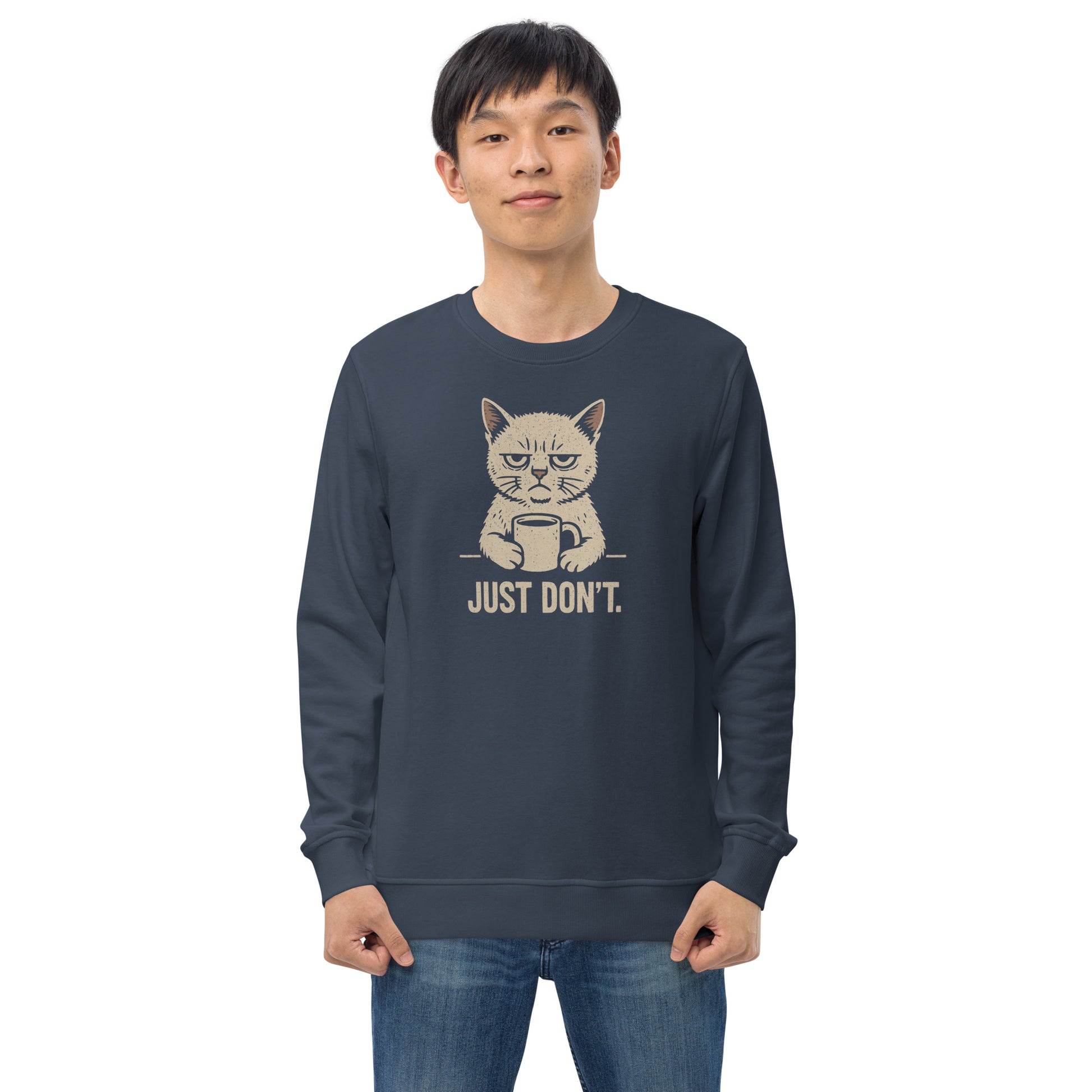 Person wearing a navy blue sweatshirt with a graphic of a cat and text 'JUST DON'T.' on a white background