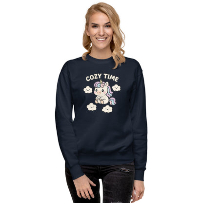 Woman wearing a navy blue sweatshirt with a unicorn graphic and 'Cozy Time' text on a white background