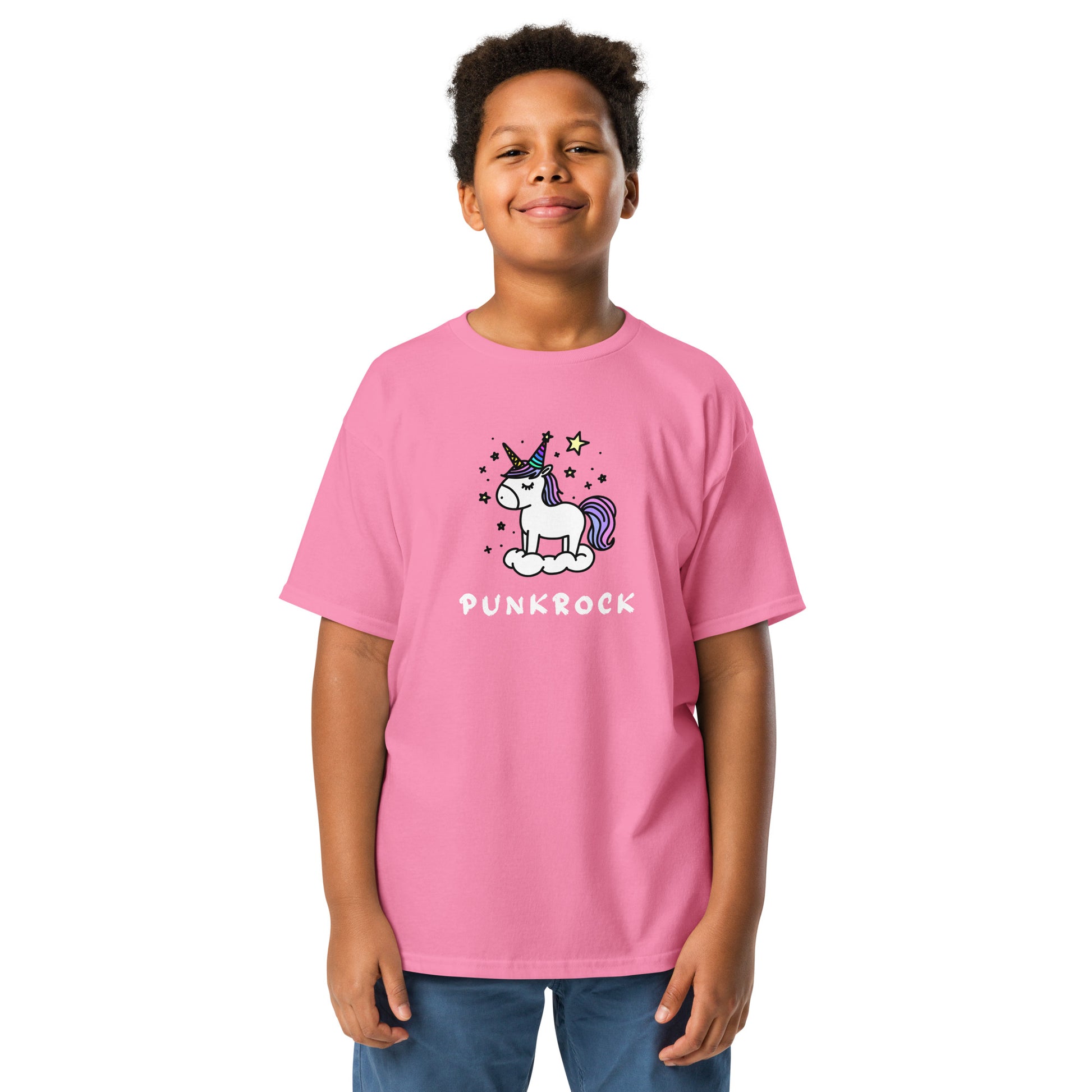 Child wearing a pink t-shirt with a unicorn graphic and 'Punkrock' text on a white background