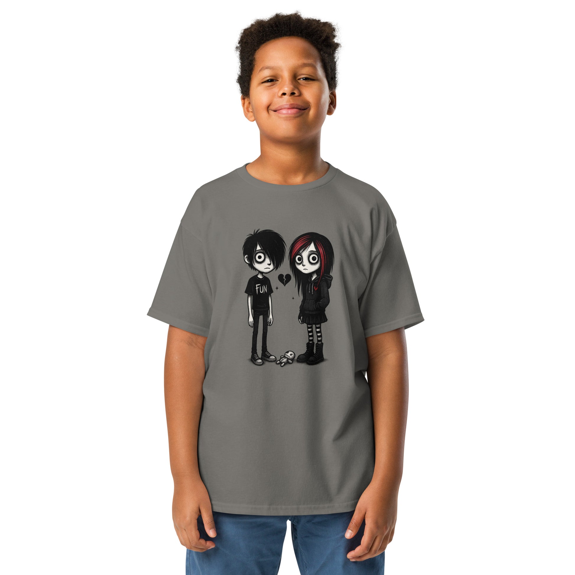 Child wearing a gray t-shirt with cartoon characters and a heart on a white background