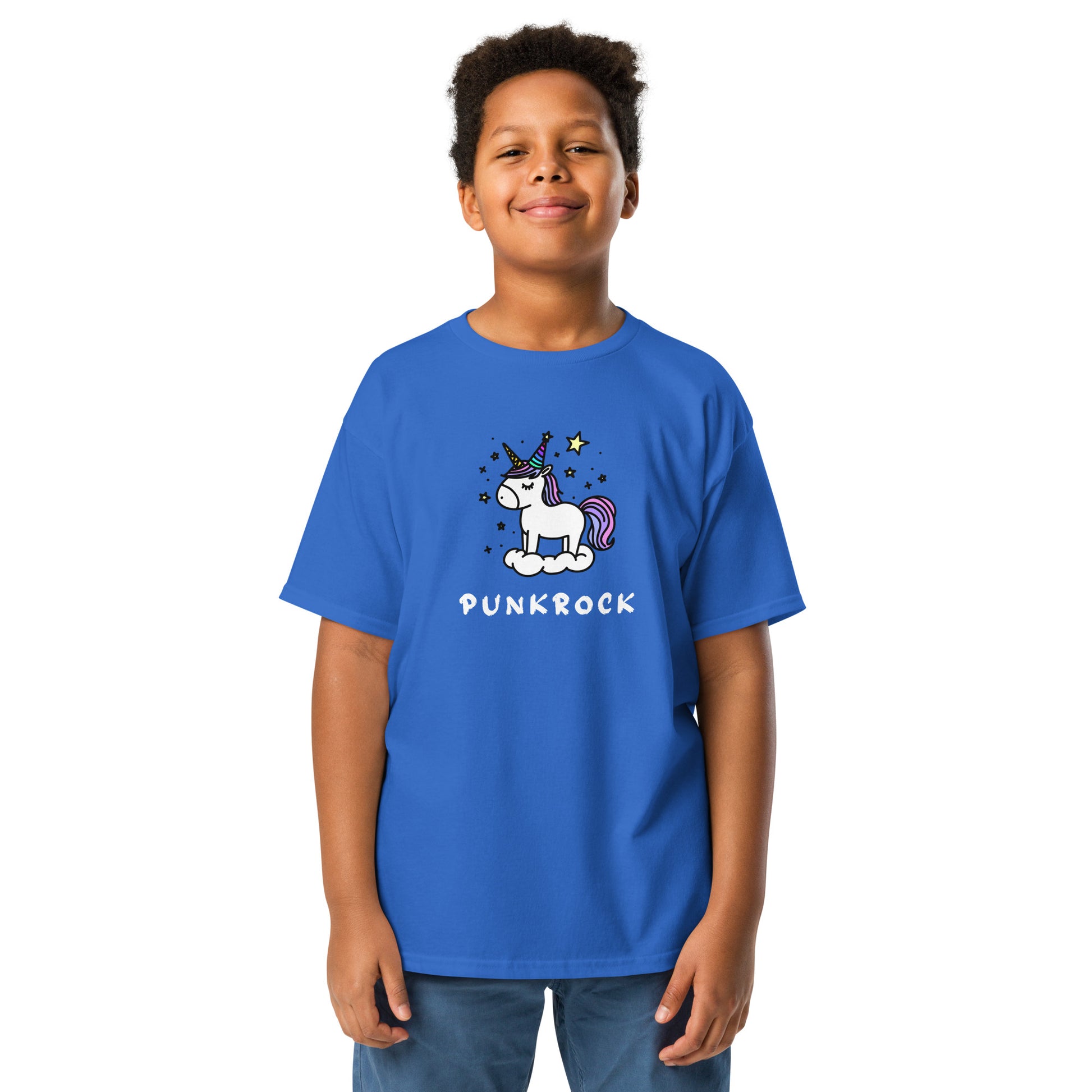 Child wearing a blue t-shirt with a unicorn graphic and 'Punkrock' text on a white background