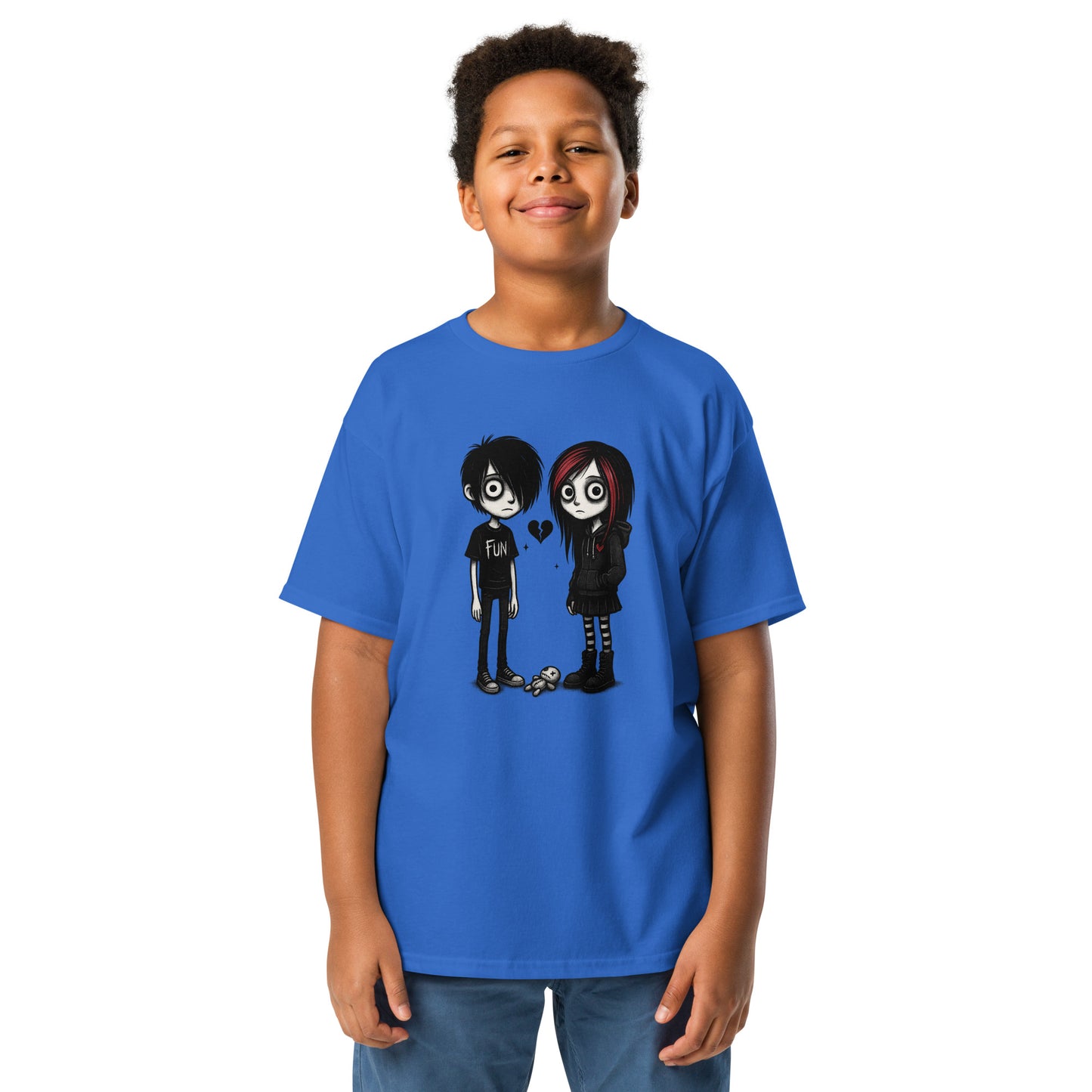 Child wearing a blue t-shirt with cartoon characters on a white background