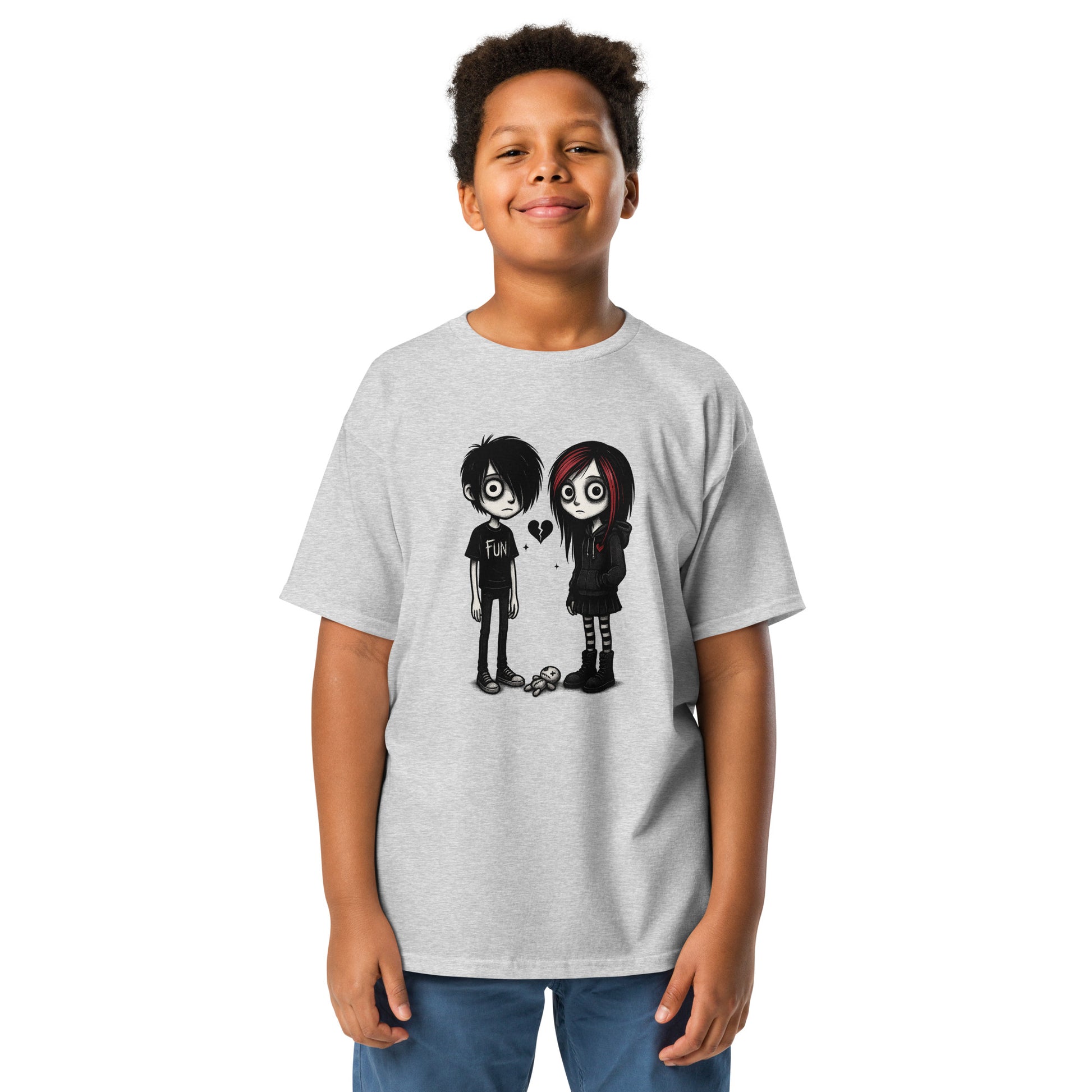 Child wearing a gray t-shirt with cartoon characters on a white background